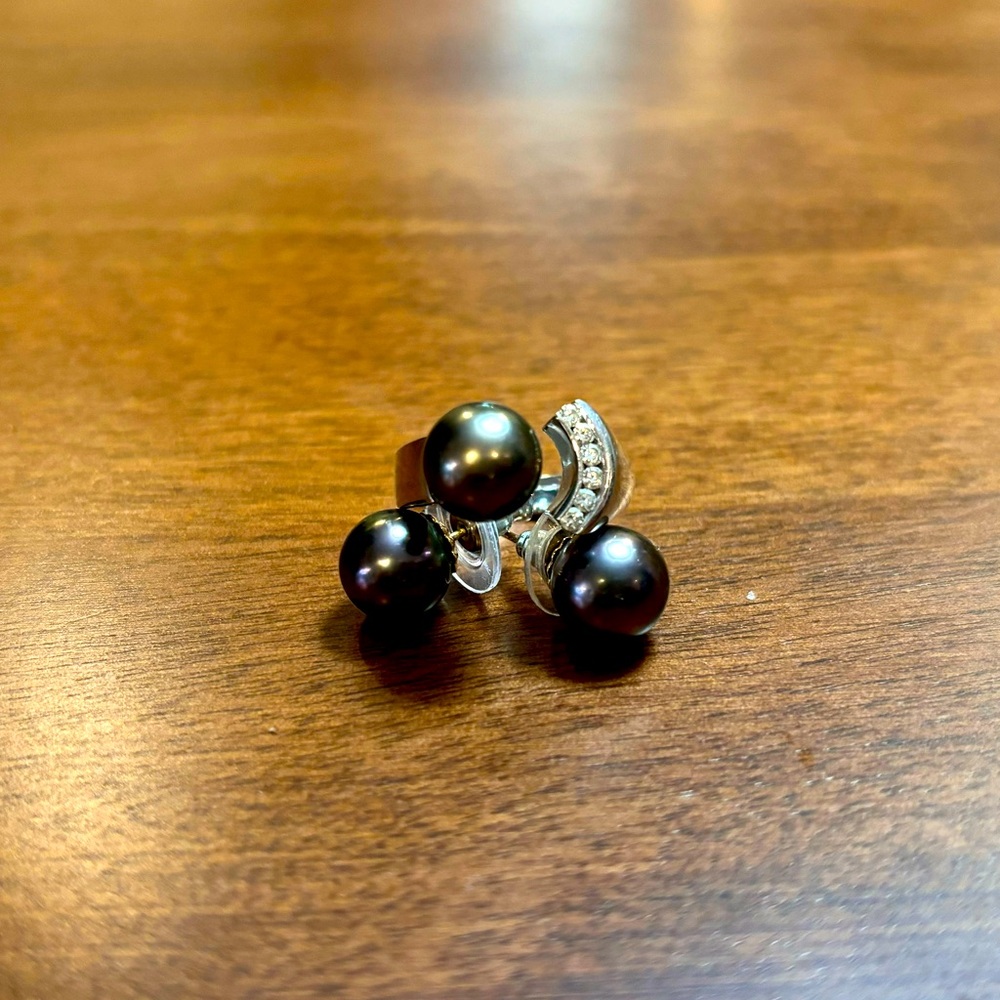 Tahitian black pearl earrings and Tahitian black pearl ring.